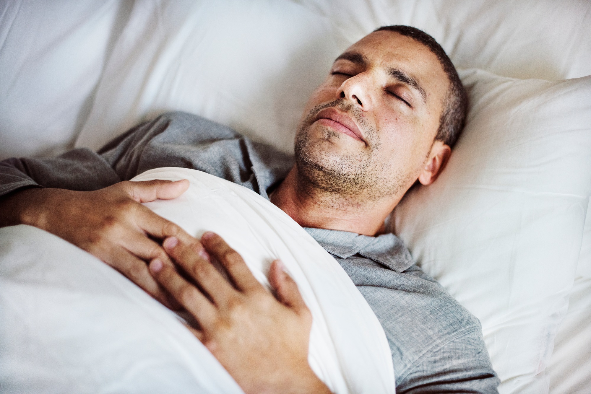 A man sleeping on a bed